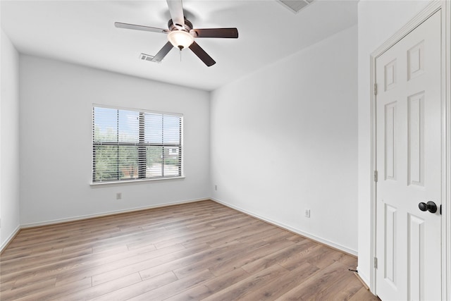 empty room featuring ceiling fan and light hardwood / wood-style floors