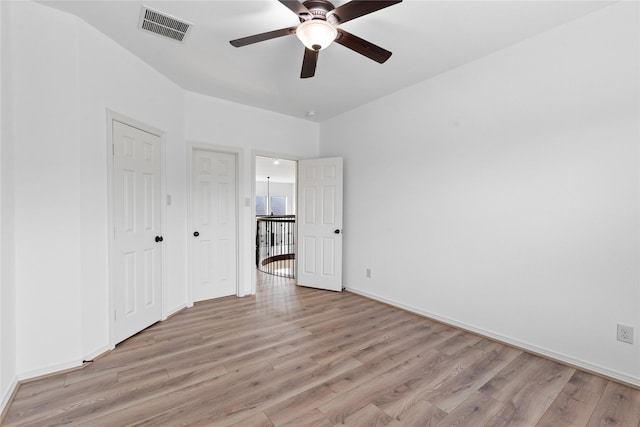 unfurnished bedroom featuring ceiling fan and light wood-type flooring