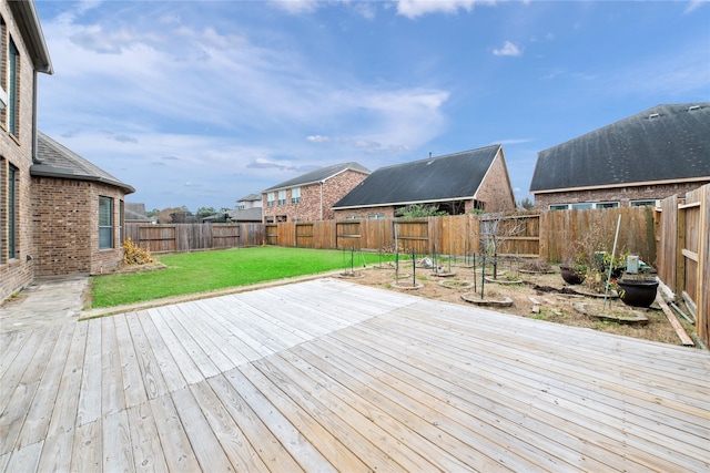 wooden deck with a lawn