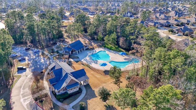 birds eye view of property with a residential view