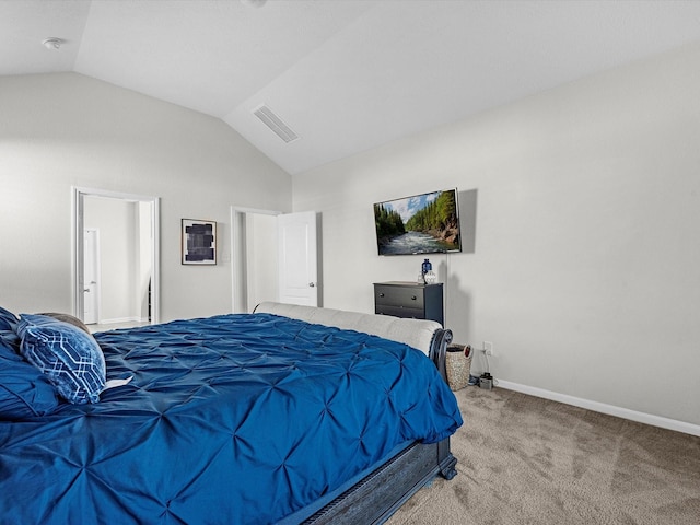 bedroom featuring carpet flooring and vaulted ceiling