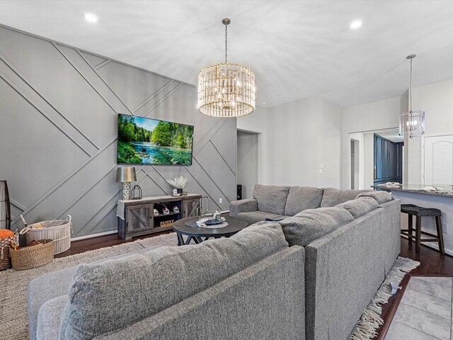 living room featuring hardwood / wood-style floors and an inviting chandelier