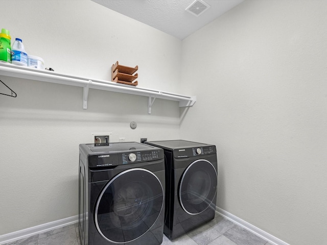 laundry area with washer and dryer