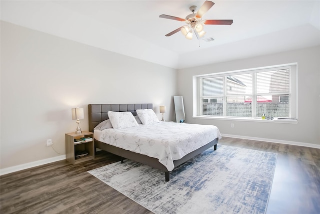 bedroom featuring ceiling fan and dark hardwood / wood-style floors