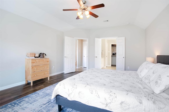 bedroom with lofted ceiling, dark wood-type flooring, and ceiling fan