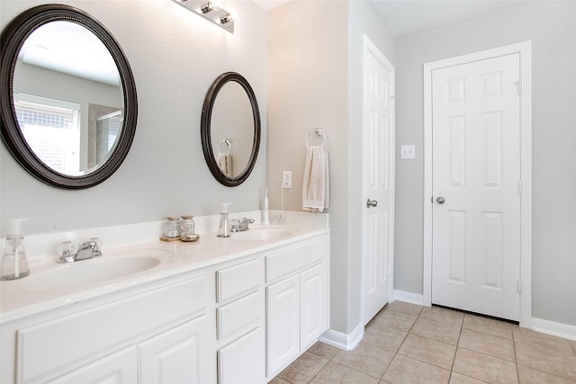 bathroom featuring tile patterned flooring and vanity