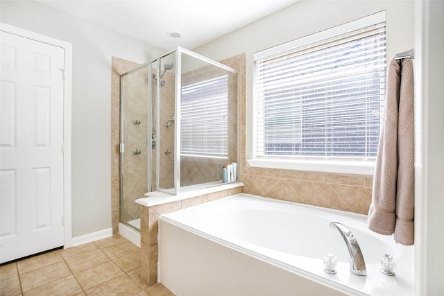 bathroom with tile patterned flooring and separate shower and tub