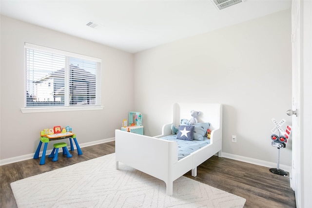 bedroom featuring dark wood-type flooring