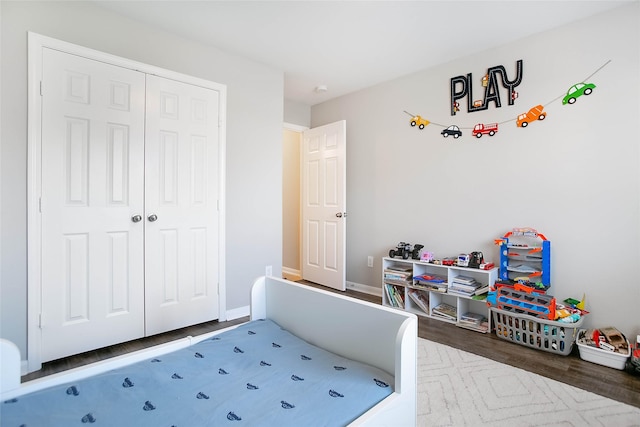 interior space with dark hardwood / wood-style flooring and a closet