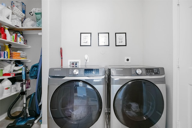 clothes washing area featuring separate washer and dryer