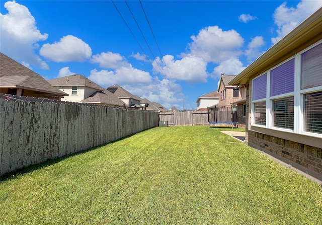 view of yard with a trampoline