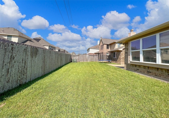 view of yard featuring a trampoline