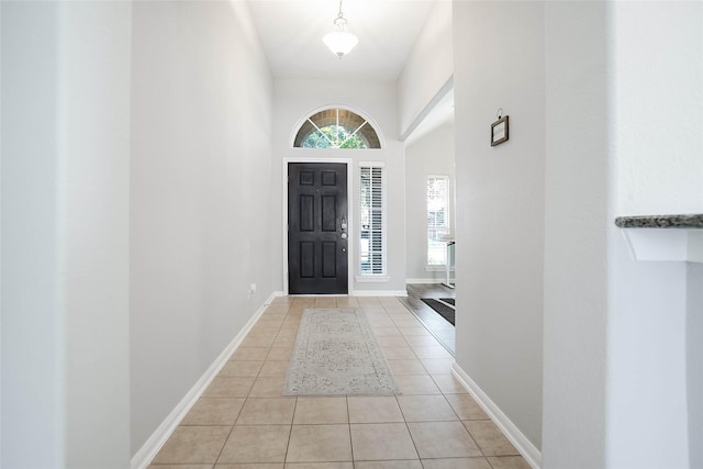 foyer featuring light tile patterned flooring