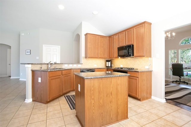 kitchen with light tile patterned flooring, sink, kitchen peninsula, and black appliances