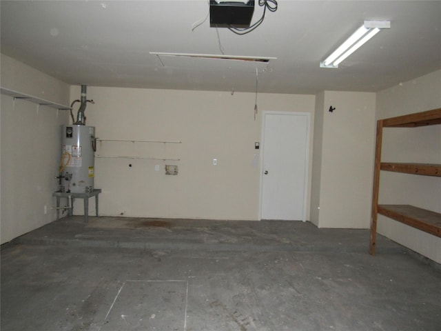 garage with a garage door opener and gas water heater