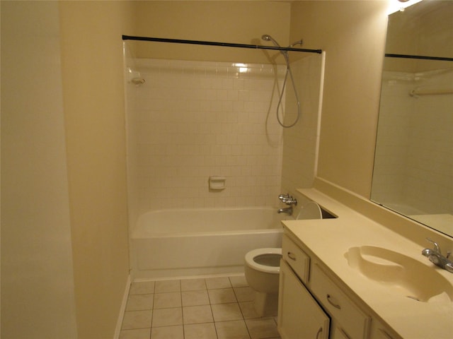 full bathroom with tile patterned flooring, vanity, tiled shower / bath combo, and toilet