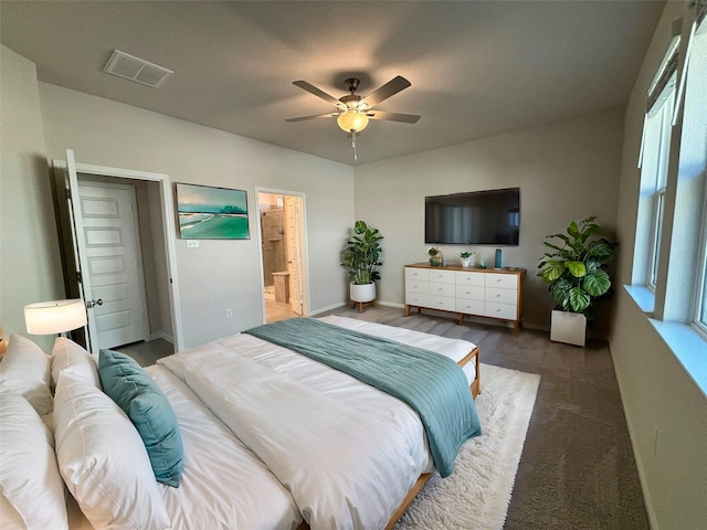 bedroom with multiple windows, connected bathroom, and ceiling fan