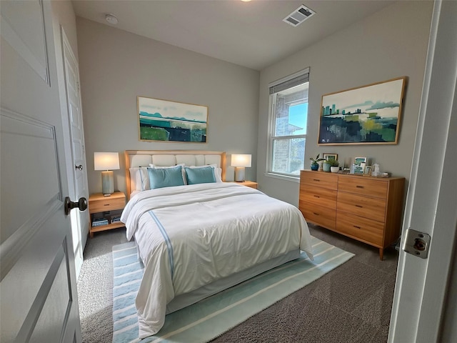 bedroom featuring dark colored carpet