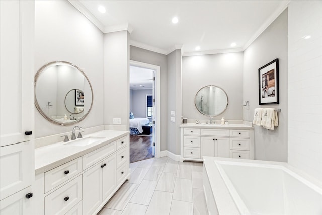 bathroom with crown molding, a tub to relax in, vanity, and tile patterned flooring