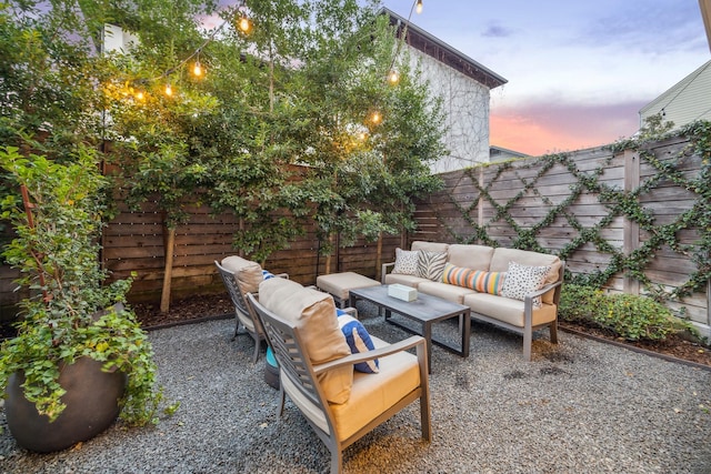 patio terrace at dusk with an outdoor living space