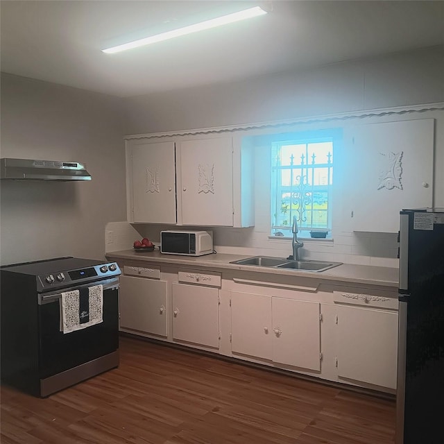 kitchen featuring white cabinetry, sink, dark wood-type flooring, and stainless steel appliances