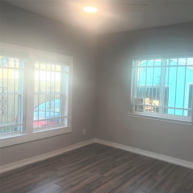 unfurnished room featuring dark hardwood / wood-style floors