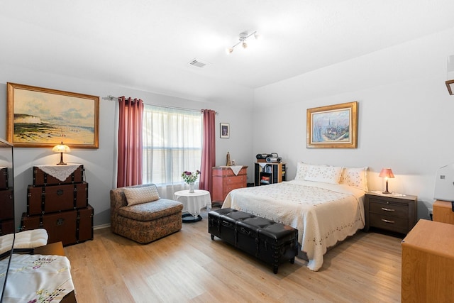 bedroom with light hardwood / wood-style flooring