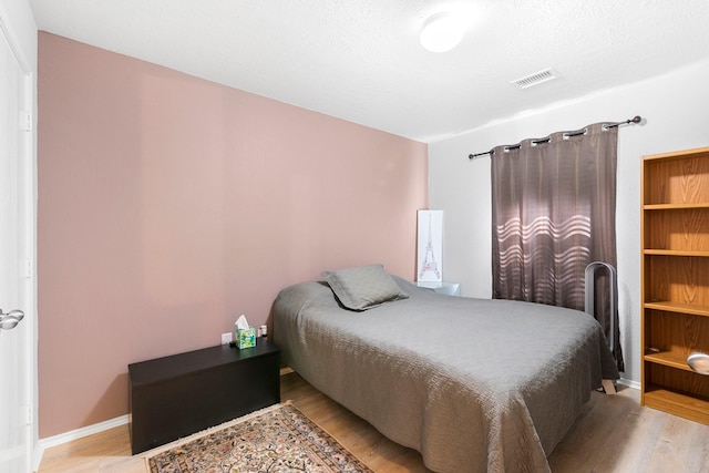 bedroom featuring light hardwood / wood-style floors