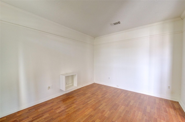 spare room with hardwood / wood-style flooring