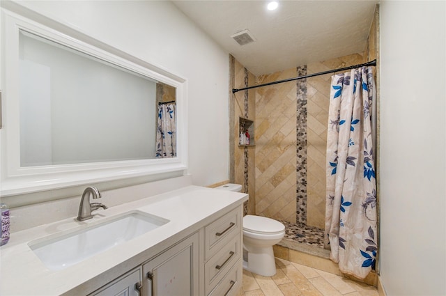 bathroom with vanity, a shower with curtain, and toilet