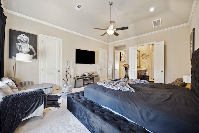 carpeted bedroom with connected bathroom, ornamental molding, and ceiling fan