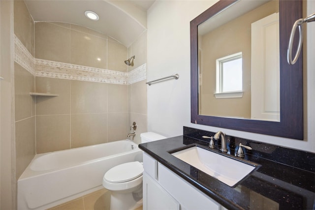 full bathroom with vanity, toilet, and tiled shower / bath combo