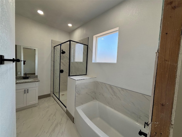 bathroom featuring vanity and separate shower and tub