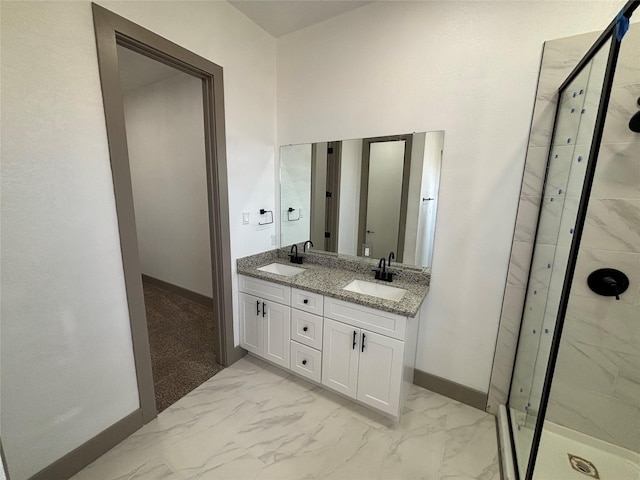 bathroom with vanity and a shower with door