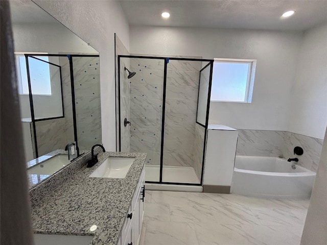 bathroom with vanity and plus walk in shower