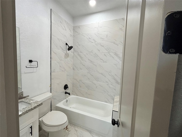 full bathroom with vanity, toilet, and tiled shower / bath