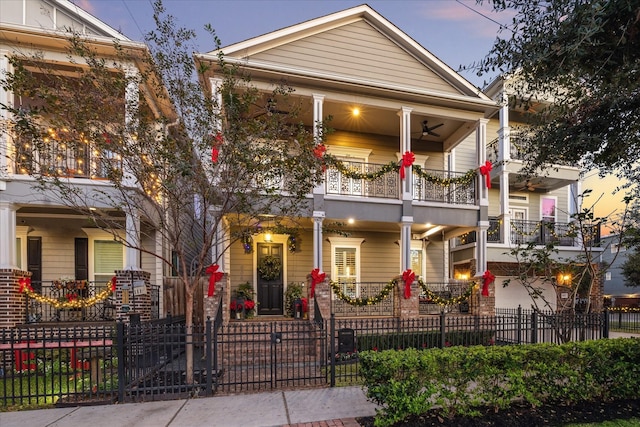 view of front of property featuring a balcony and a porch