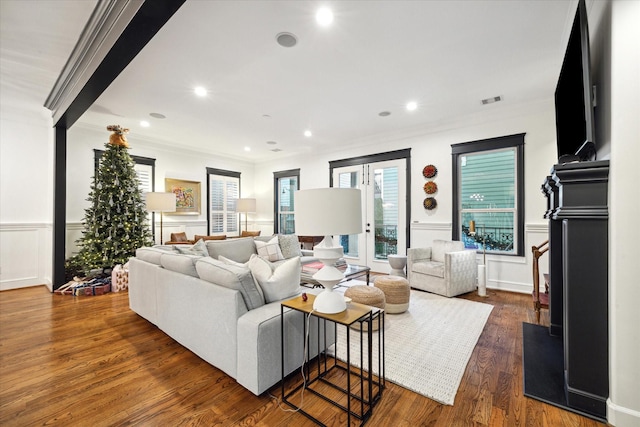 living room with crown molding and dark hardwood / wood-style floors