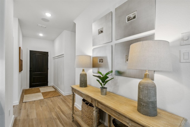 corridor featuring light hardwood / wood-style floors