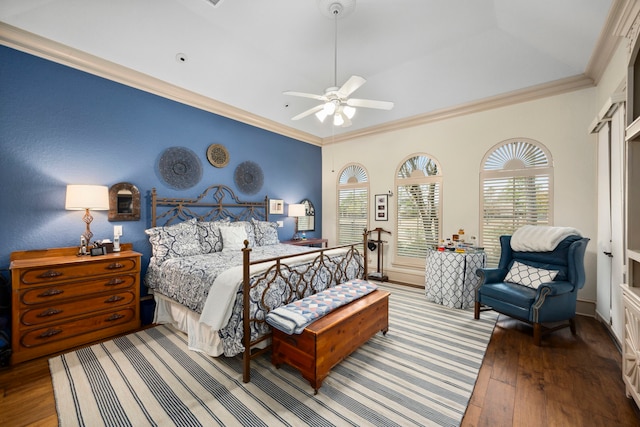 bedroom with ceiling fan, ornamental molding, and wood-type flooring