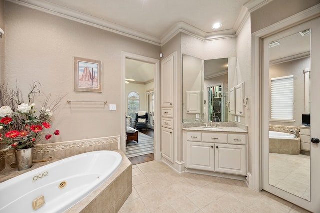 bathroom featuring ornamental molding, vanity, tiled bath, and tile patterned flooring