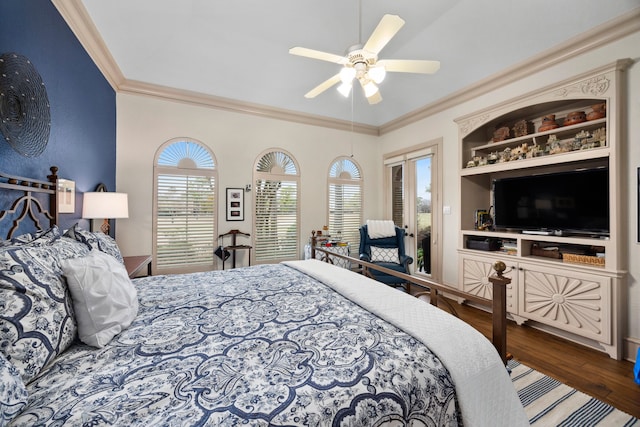 bedroom featuring hardwood / wood-style flooring, ornamental molding, and ceiling fan