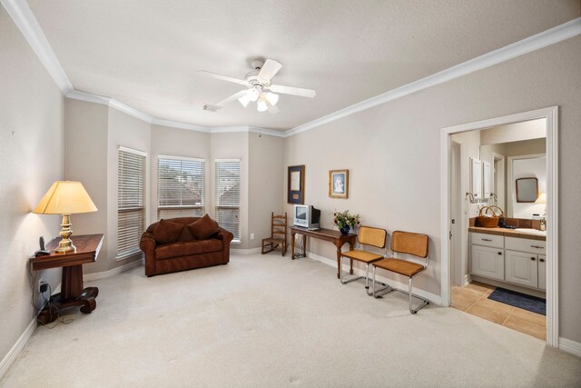 sitting room featuring crown molding, carpet flooring, and ceiling fan