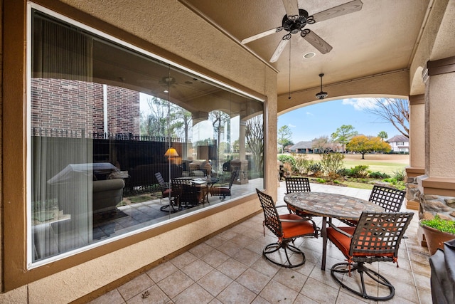 view of patio / terrace featuring ceiling fan