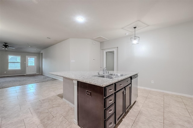 kitchen featuring pendant lighting, sink, ceiling fan, a center island with sink, and stainless steel dishwasher