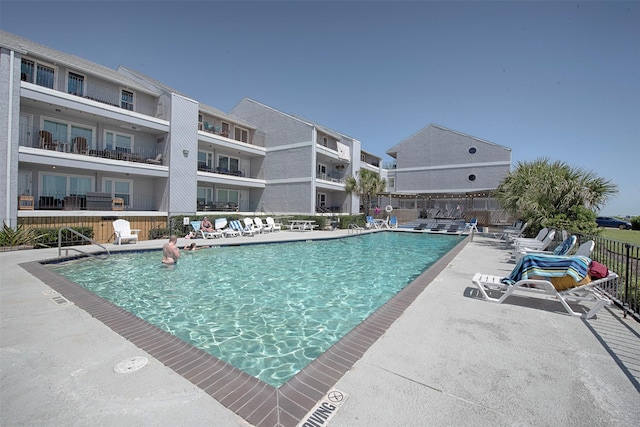 view of swimming pool featuring a patio area