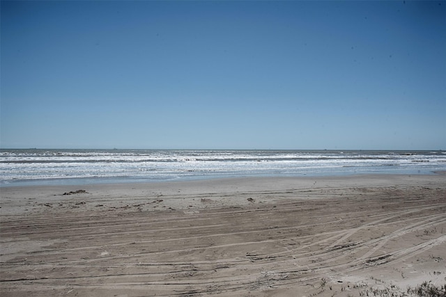 property view of water featuring a beach view