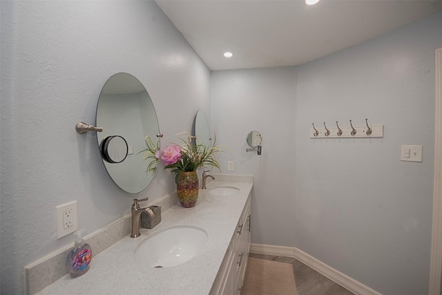 bathroom featuring vanity and wood-type flooring