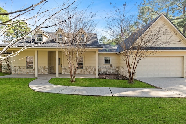 view of front of home with a garage and a front yard