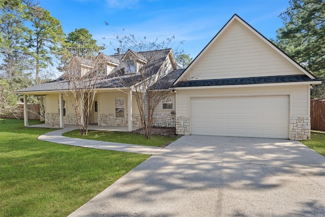 view of front facade with a garage, covered porch, and a front lawn